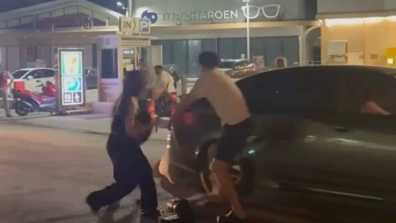 A Pattaya fight near Bali Hai Pier left a 20 year old woman injured after a car reversed over her during a roadside brawl.