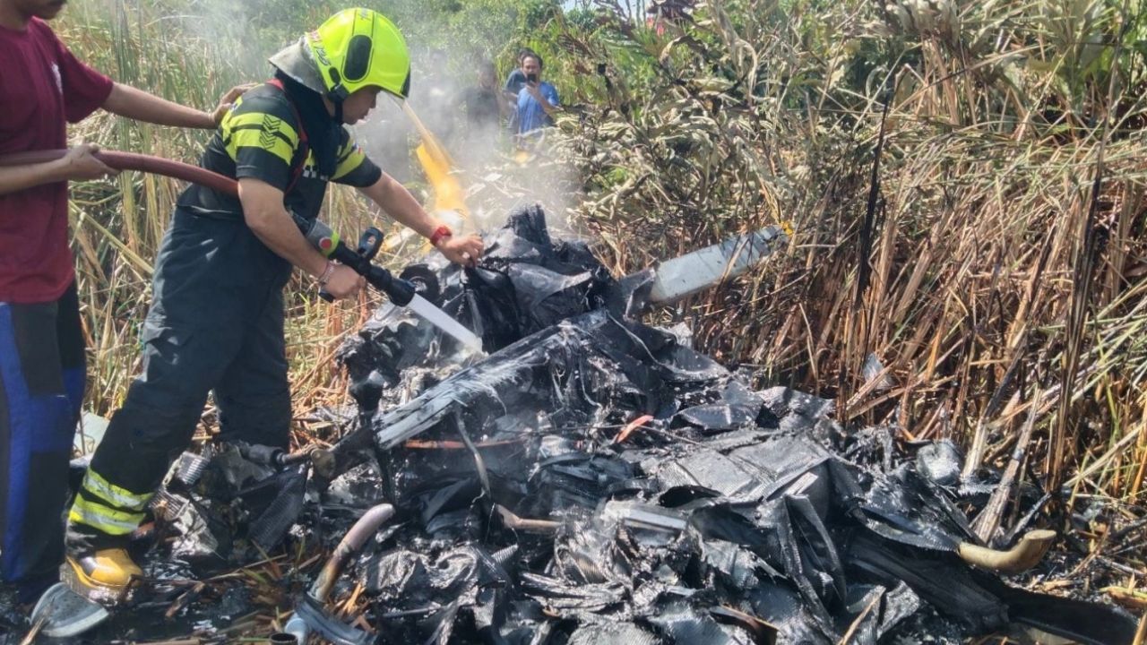Two people were injured after a private helicopter crashed and caught fire near a BTS maintenance centre in Samut Prakan.