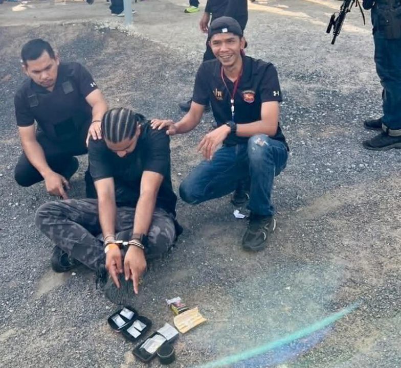 Police arrested an Indian man on Koh Pha Ngan after gun videos led officers to drugs, alleged drug menus, and an overstay charge.