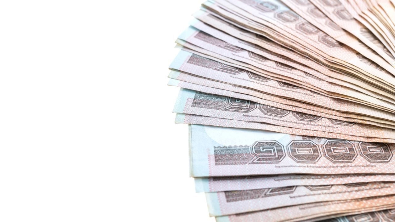 Keep the money on the table and not at your feet | Image by mrsiraphol from Freepik Strange laws in Thailand
